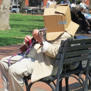 white house 6 man with box on head strumming violin sq